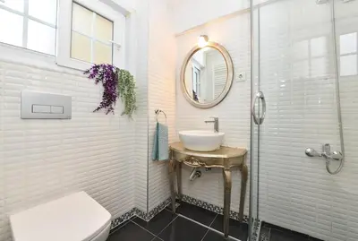 a bathroom with a sink and a mirror at Comfortable Bright Home AC Galata in Istanbul