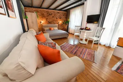 a living room with a couch and a table at Cute Retro Home Balcony AC Galata in Istanbul