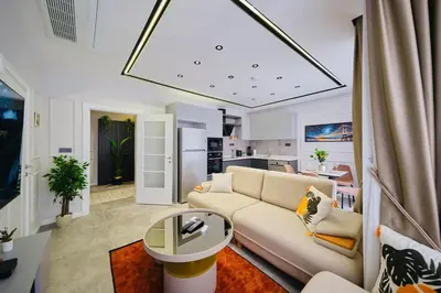 a living room with a couch and a table at Taksim Square 1 plus 1 fully equipped air conditioned luxury apartment in Istanbul