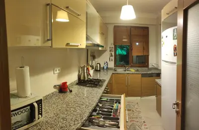 a kitchen with a counter with a stove top oven at family villas sapanca in Sapanca