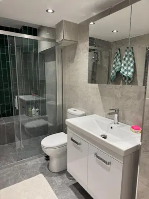 a bathroom with a toilet and a sink and a shower at Heart of the City - Zey in Güzelce