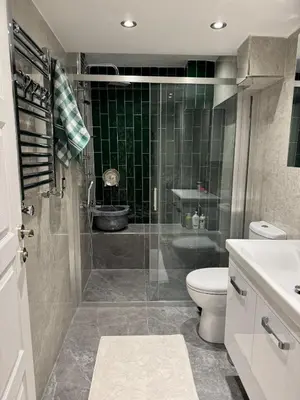 a bathroom with a shower and a toilet and a sink at Heart of the City - Zey in Güzelce