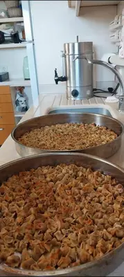 two trays filled with food in a kitchen at Meşeliev Pansiyon in Demirköy