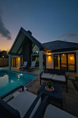 a villa with a swimming pool at night at MoonSA Boutique Villas in Sapanca