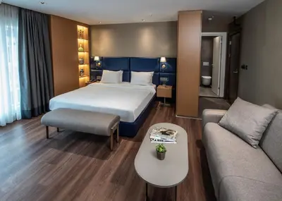 a hotel room with a bed and a couch at Hotel Bosfora in Istanbul