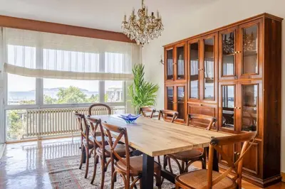 a dining room with a wooden table and chairs at Spacious 4BR Home - Stunning Bosphorus Views! #390 in Istanbul