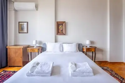 a bedroom with a large white bed with two towels at Spacious 4BR Home - Stunning Bosphorus Views! #390 in Istanbul