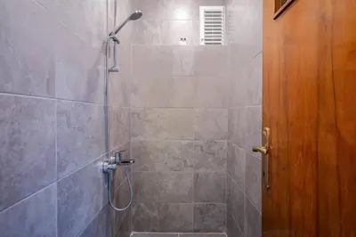 a bathroom with a shower with a glass door at Spacious 4BR Home - Stunning Bosphorus Views! #390 in Istanbul