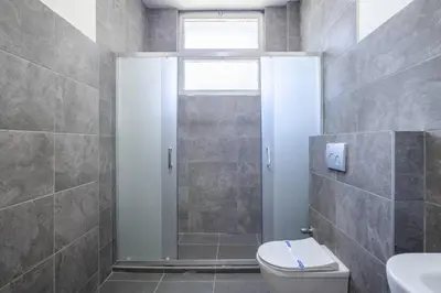 a bathroom with a shower and a toilet and a sink at Spacious 4BR Home - Stunning Bosphorus Views! #390 in Istanbul