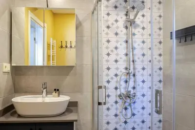 a bathroom with a sink and a shower at Charming New 1BD Home - Close to Shoreline! #395 in Sarıyer