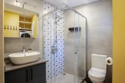 a bathroom with a sink and a toilet and a shower at Charming New 1BD Home - Close to Shoreline! #395 in Sarıyer
