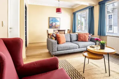 a living room with a couch and a table at Charming New 1BD Home - Close to Shoreline! #395 in Sarıyer