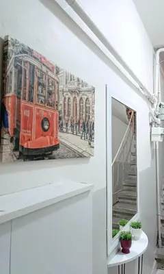 a painting of a red tram on a wall at Apartment Taksim-Beyoğlu 2 in Istanbul