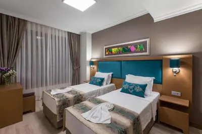 a hotel room with two beds and a window at Ferman Hilal Hotel-Special Category in Istanbul