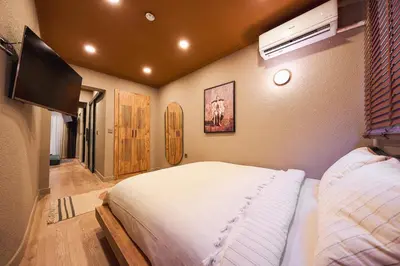 a bedroom with a bed and a flat screen tv at Tare Suites Beşiktaş in Istanbul