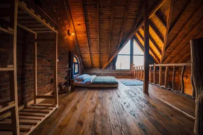 a large room with a bed in a wooden building at oasis sapanca in Sapanca