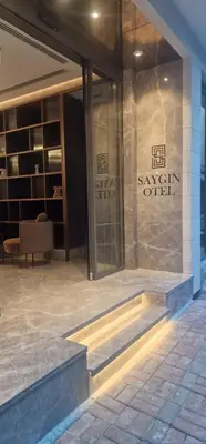 a building with a sign on the side of it at Saygın Hotel Beşiktaş in Istanbul