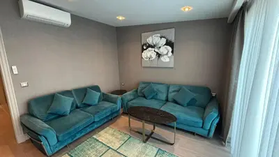 a living room with a couch and a table at Saygın Hotel Beşiktaş in Istanbul