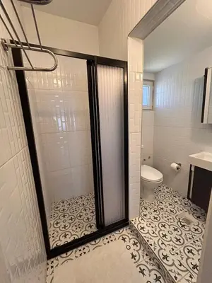 a bathroom with a shower with a toilet at i1 House Hotel with Lovely Seaview Terrace in Istanbul