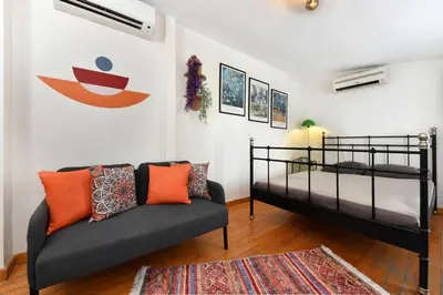 a living room with a bed and a couch at Cute Home Balcony Retro Design AC Galata in Istanbul