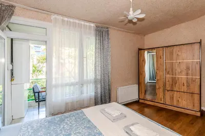 a bedroom with a bed and a large window at Equipped Flat w Balcony - In The Arnavutköy - Bebek in Istanbul