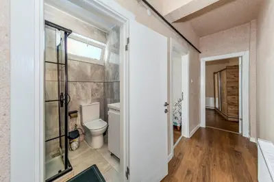 a bathroom with a toilet and a window at Equipped Flat w Balcony - In The Arnavutköy - Bebek in Istanbul