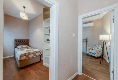 a bedroom with a bed and a chair in a room at Equipped Flat w Balcony - In The Arnavutköy - Bebek in Istanbul