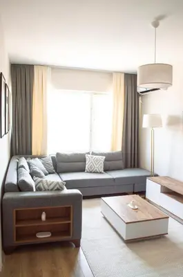 a living room with a couch and a table at Luxe Suite AI28 in Esenyurt