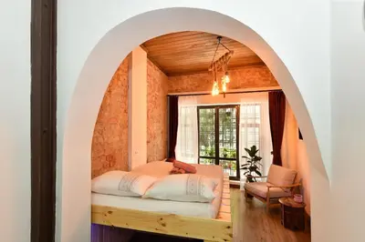 an arched room with a bed and a window at Wooden Style AC Galata in Istanbul