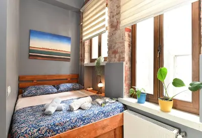 a bedroom with a bed with stuffed animals on it at Historical Wooden Style AC in Beyoğlu Galata in Istanbul