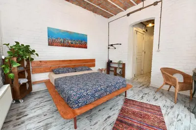 a bedroom with a bed and a chair in a room at 2BR Unique Terrace 2 AC in Beyoğlu Galata in Istanbul