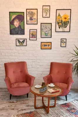 a living room with two chairs and a coffee table at 2BR Unique Terrace 2 AC in Beyoğlu Galata in Istanbul