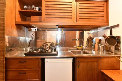 a kitchen with a sink and a stove top oven at Historical Flat Unique Terrace AC in Beyoğlu Galata in Istanbul