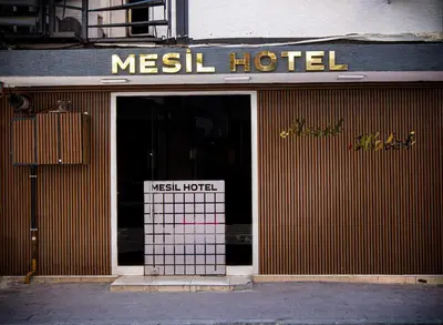 a door to a mesel hotel on a street at Mesil Hotel in Istanbul