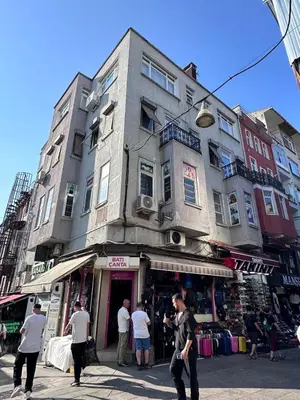 a group of people standing in front of a building at The Kinyas House - Apartment in Kadıköy Historical Fishermen's Market in Istanbul