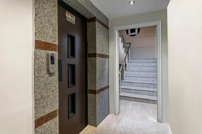 a hallway with stairs in a house at Çorlu Temel Hotel in Corlu