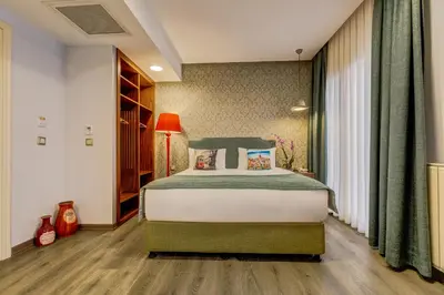 a bedroom with a large bed in a room at Sometimes Hotel Taksim in Istanbul