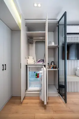 a kitchen with an open refrigerator in a room at Pia Global - Nevizade in Istanbul