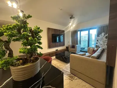 a living room with a couch and a table at Luxury family-balcony apt in Istanbul