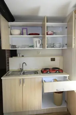 a kitchen with a sink and a counter top at Coskun apt in Istanbul