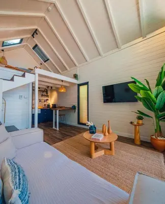 a living room with a couch and a table at Boheme Bungalow Sapanca in Sapanca