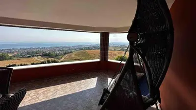 a room with a view of a balcony with a camera at Luxury Mansion Amazing View, Hidden Garden in Celâliye