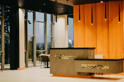 a reception desk in a building with windows at Melekona House in Kartepe