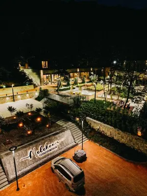a van parked in a parking lot at night at Melekona House in Kartepe