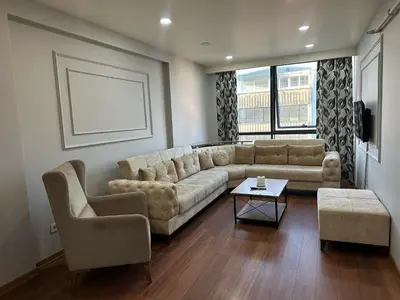a living room with a couch and two chairs at Gold Suit in Istanbul