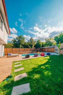 a backyard with a swimming pool and a lawn at tetova in Sapanca