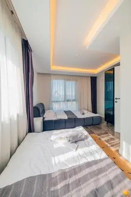 a large bedroom with two beds and a window at tetova in Sapanca