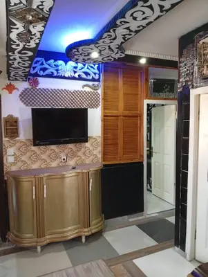 a room with a bar with a tv on the wall at Sword Hotel in Avcılar