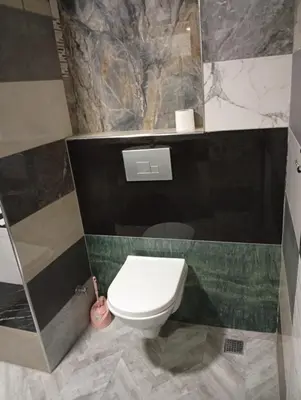 a bathroom with a white toilet in a room at Sword Hotel in Avcılar