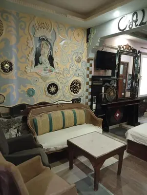 a living room with a couch and a table at Sword Hotel in Avcılar